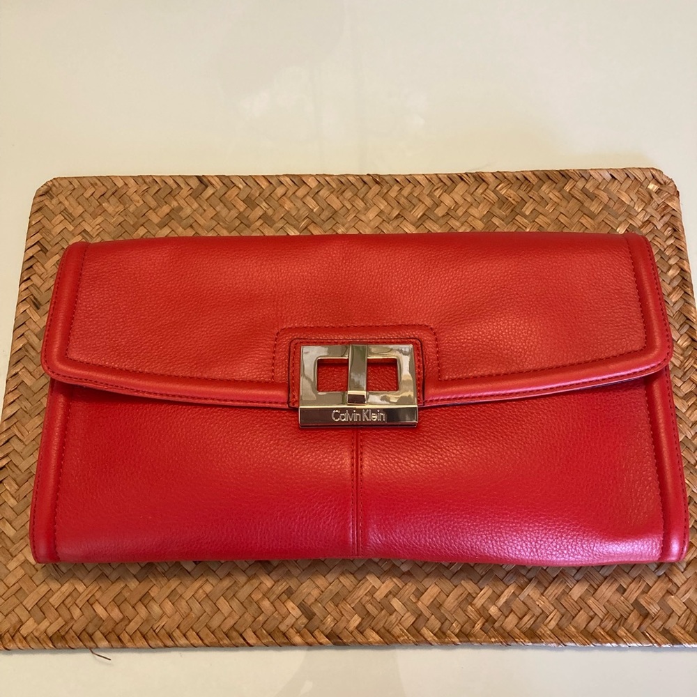 Large orangey red leather clutch Calvin Klein